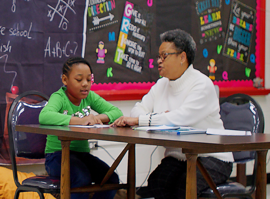 Tutor and Girl in Green Shirt