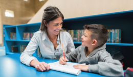 Tutor and Boy with Blue Bookshelves