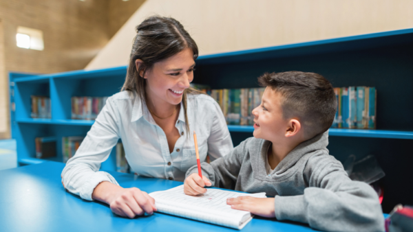 Tutor and Boy with Blue Bookshelves