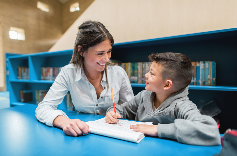 Tutor and Boy with Blue Bookshelves