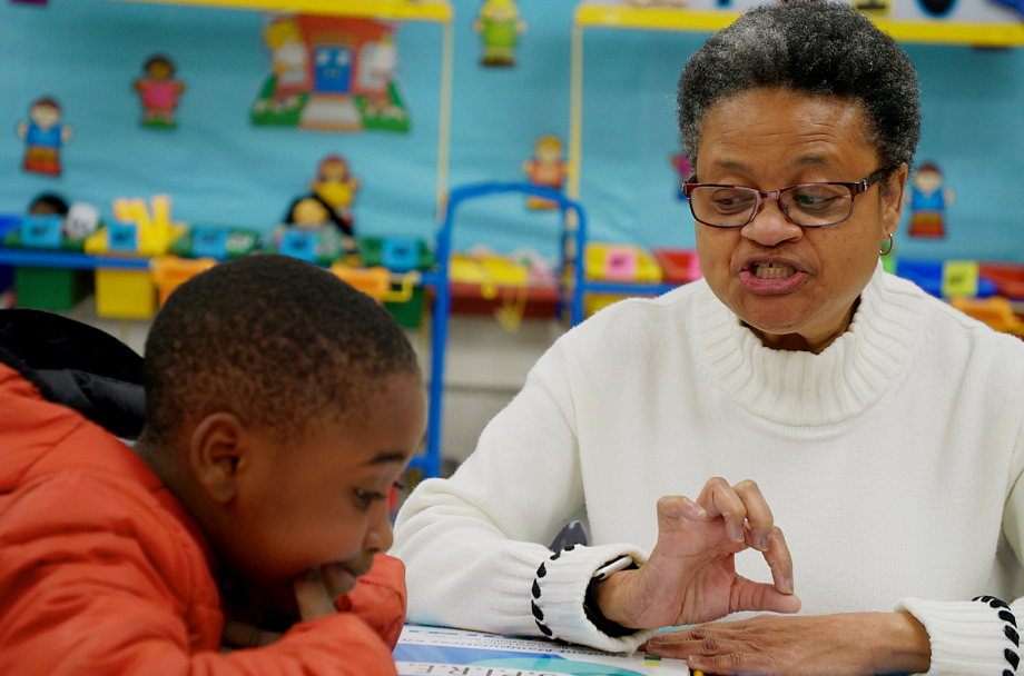 Tutor in White Sweater with Student