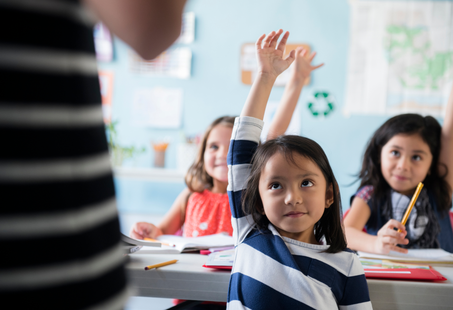 kids-raising-hands-in-class